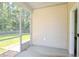 View of the screened-in back patio with view of the well-maintained backyard at 123 Lagoona Dr, Summerville, SC 29483