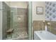 Modern bathroom features a tiled walk-in shower, a soaking tub, and stylish decor at 125 Pier View St # 408, Charleston, SC 29492