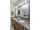 Elegant bathroom with granite countertops, double sinks, and a view of the bathtub and large walk-in closet at 125 Pier View St # 408, Charleston, SC 29492