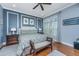 Stylish bedroom with beautiful blue walls, wainscoting, a plush bed, and a window with shutter at 125 Pier View St # 408, Charleston, SC 29492