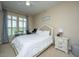 Bright bedroom featuring a comfortable bed, neutral decor, and a ceiling fan for a relaxing atmosphere at 125 Pier View St # 408, Charleston, SC 29492