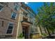 Beautiful condo exterior featuring brick accents, architectural details, and well-kept landscaping at 125 Pier View St # 408, Charleston, SC 29492