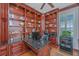 Elegant home office with custom built-ins, granite countertops, and a window offering natural light at 125 Pier View St # 408, Charleston, SC 29492