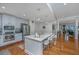Bright kitchen featuring an island with seating, stainless steel appliances, and hardwood floors at 125 Pier View St # 408, Charleston, SC 29492