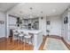 Modern kitchen with a large island, stainless steel appliances, and stylish pendant lighting at 125 Pier View St # 408, Charleston, SC 29492