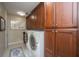 Spacious laundry room with modern washer and dryer, ample cabinet storage, and well-lit for convenience at 125 Pier View St # 408, Charleston, SC 29492