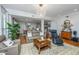 Comfortable living room with hardwood floors, leather seating, and open layout to dining and kitchen at 125 Pier View St # 408, Charleston, SC 29492