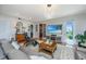 Bright living room with hardwood floors, modern lighting, comfortable seating, and a large-screen television at 125 Pier View St # 408, Charleston, SC 29492