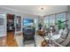 Comfortable living room featuring hardwood floors, modern lighting, access to the study and comfortable seating at 125 Pier View St # 408, Charleston, SC 29492