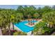Stunning community pool featuring a pergola, lush landscaping, and lounge chairs for relaxation at 125 Pier View St # 408, Charleston, SC 29492
