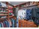 Walk-in closet with custom shelving and wooden drawers for maximum storage at 125 Pier View St # 408, Charleston, SC 29492