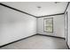 Bright bedroom with gray walls, black trim, and wood-look laminate flooring at 1326 Givhans Rd, Ridgeville, SC 29472