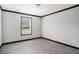 Neutral bedroom featuring modern flooring and a window for natural light at 1326 Givhans Rd, Ridgeville, SC 29472