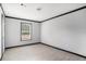 Bright bedroom features gray walls, black trim, and laminate flooring at 1326 Givhans Rd, Ridgeville, SC 29472