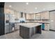 Bright kitchen featuring a large island, stainless steel appliances, and sleek countertops at 1326 Givhans Rd, Ridgeville, SC 29472