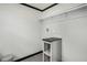 Laundry room features gray walls, black trim, and laminate flooring at 1326 Givhans Rd, Ridgeville, SC 29472