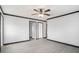 The living room offers gray walls, black trim, and wood-look laminate flooring at 1326 Givhans Rd, Ridgeville, SC 29472