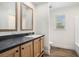 Bathroom featuring double vanity, spacious shower, and wood-look flooring at 1332 Givhans Rd, Ridgeville, SC 29472