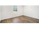 Bedroom showcasing wood-look floors, neutral walls, and a window for natural light at 1332 Givhans Rd, Ridgeville, SC 29472