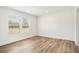 Bright and airy bedroom with hardwood flooring and plenty of natural light from the windows at 1332 Givhans Rd, Ridgeville, SC 29472