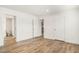 Bedroom featuring hardwood floors, bright walls, and direct access to an ensuite bathroom at 1332 Givhans Rd, Ridgeville, SC 29472