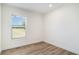 Bedroom showcasing wood-look floors, neutral walls, and a window for natural light at 1332 Givhans Rd, Ridgeville, SC 29472