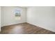 Bedroom showcasing wood-look floors, neutral walls, and a window for natural light at 1332 Givhans Rd, Ridgeville, SC 29472