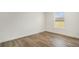 Bedroom showcasing wood-look floors, neutral walls, and a window for natural light at 1332 Givhans Rd, Ridgeville, SC 29472