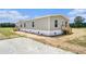 Charming single-story home featuring gray siding, white trim, and a welcoming back porch at 1332 Givhans Rd, Ridgeville, SC 29472
