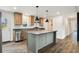 Bright kitchen featuring stainless steel appliances, a center island, and wood cabinets at 1332 Givhans Rd, Ridgeville, SC 29472
