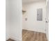 Practical laundry area with wood-look flooring, shelving, and a bright, clean aesthetic at 1332 Givhans Rd, Ridgeville, SC 29472