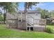 Multi-tiered backyard deck and stairs offer an outdoor living space and overlook backyard at 134 Hummingbird Ave, Ladson, SC 29456