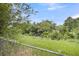 This property features a spacious backyard with a wooded tree line and creek views at 134 Hummingbird Ave, Ladson, SC 29456