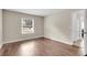 Bedroom with wood-look floors and a window offering natural light at 134 Hummingbird Ave, Ladson, SC 29456