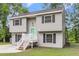 Charming two-story home with green door, front porch, and manicured lawn at 134 Hummingbird Ave, Ladson, SC 29456