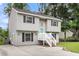 Well-maintained two-story home with a green door and manicured lawn at 134 Hummingbird Ave, Ladson, SC 29456
