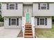 Charming split-level home features a tidy lawn, painted siding, and a bright green front door at 134 Hummingbird Ave, Ladson, SC 29456