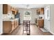 Bright kitchen featuring stainless steel appliances and a wooden dining table at 134 Hummingbird Ave, Ladson, SC 29456