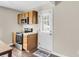 Functional kitchen with stainless steel appliances and access to the backyard at 134 Hummingbird Ave, Ladson, SC 29456