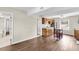 Open living area with wood-look floors, kitchen, and small dining table at 134 Hummingbird Ave, Ladson, SC 29456