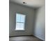 Bright bedroom with new window, hardwood floors, and neutral walls at 124 Ireland Dr, Summerville, SC 29486