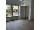 Bedroom with natural light, hardwood floors, and a view of a new construction neighborhood at 124 Ireland Dr, Summerville, SC 29486