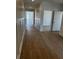Hallway showcasing wood-look flooring and decorative wall paneling at 124 Ireland Dr, Summerville, SC 29486