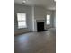 Bright living room with wood-look floors and a modern fireplace at 124 Ireland Dr, Summerville, SC 29486