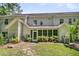 Exterior view of house with screened-in porch and well-maintained yard and mature landscaping at 1682 Camfield Ln, Mount Pleasant, SC 29466