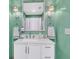 Bright bathroom featuring green walls, a white vanity, and a large mirror with sconce lighting at 1682 Camfield Ln, Mount Pleasant, SC 29466