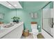 Bright bathroom with double vanity, tiled floors, framed shower, and matching towel set at 1682 Camfield Ln, Mount Pleasant, SC 29466