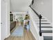 Bright entryway featuring wood floors, a staircase, and an open view to the living spaces at 1682 Camfield Ln, Mount Pleasant, SC 29466