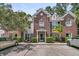 Charming brick townhouse featuring manicured landscaping and a welcoming front entrance at 1682 Camfield Ln, Mount Pleasant, SC 29466