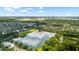 Aerial view showcasing the community's lake, and stunning waterfront views beyond at 1722 Trewin Ct, Charleston, SC 29492